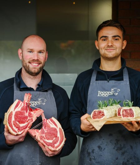 Butchers with a rib of beef and spiced venison