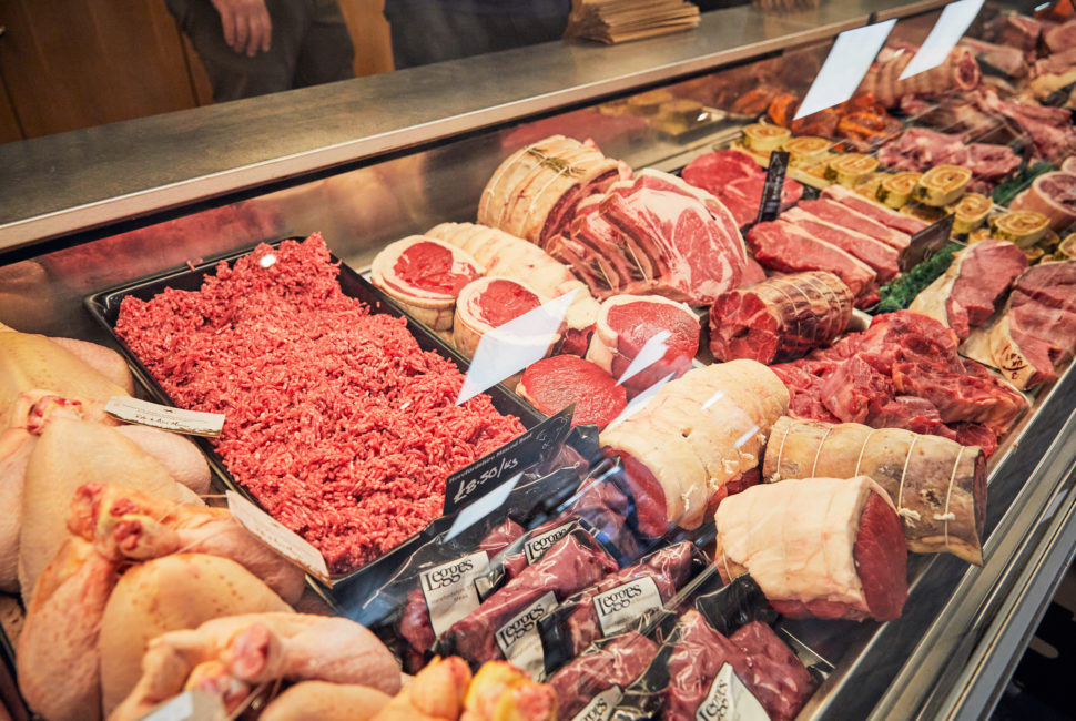 A butcher shop counter and friendly service area