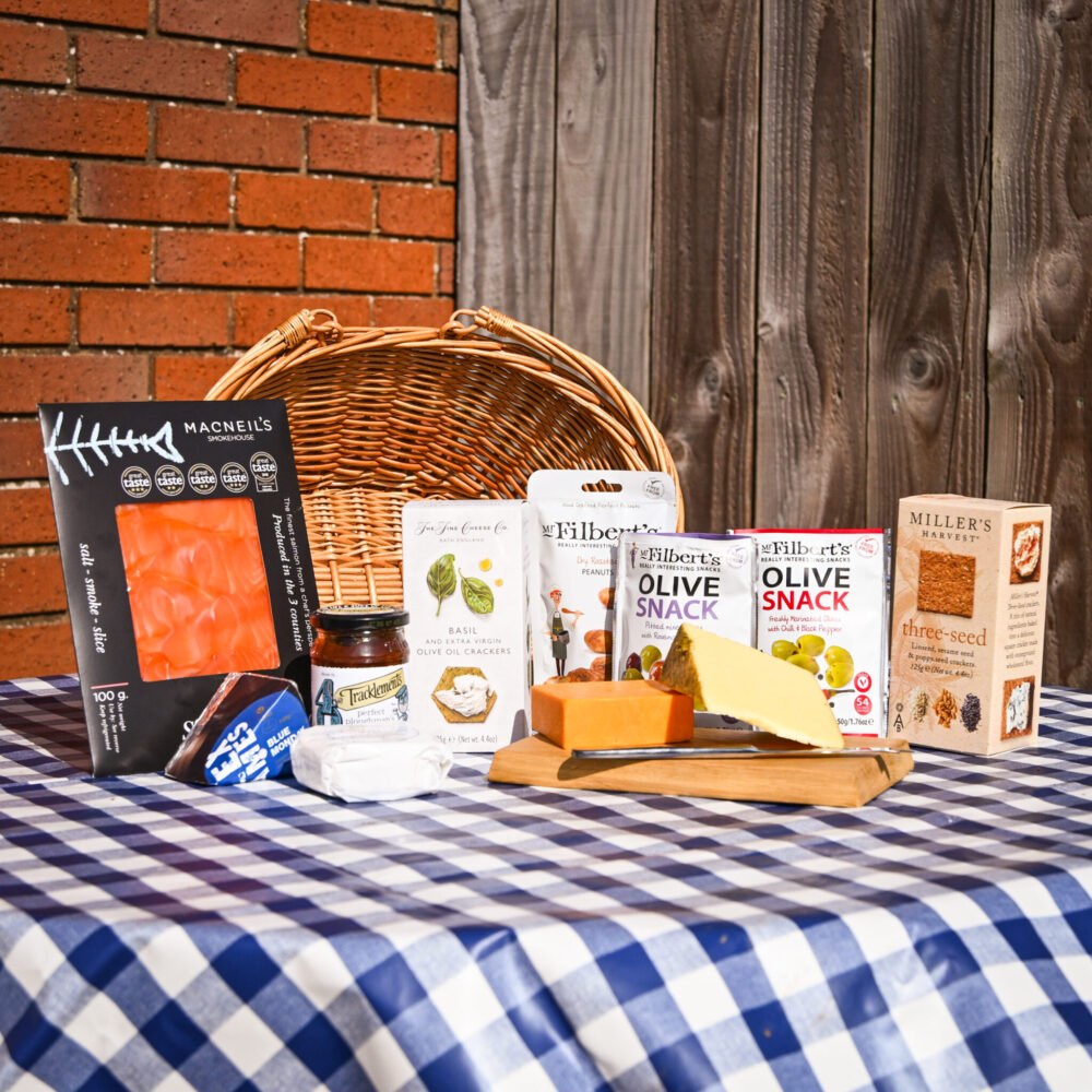 A gift hamper from Herefordshire filled with smoked salmon, cheeses, crackers, olives and nuts.