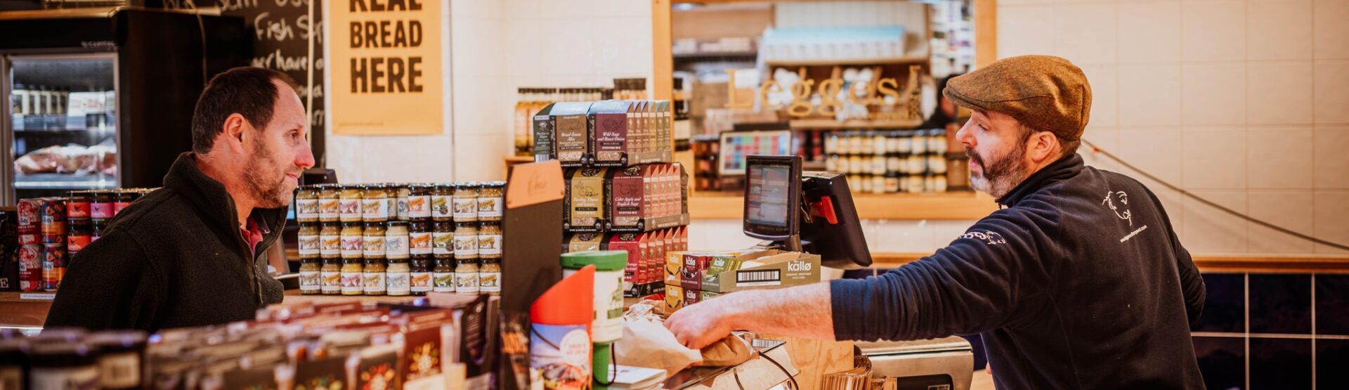 Customer being served by a butcher