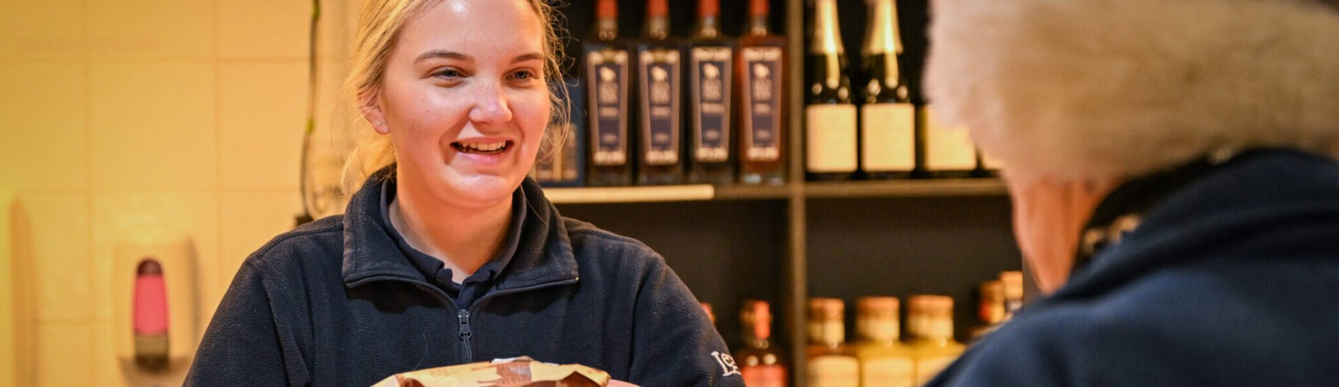 Smiling team member serving a customer