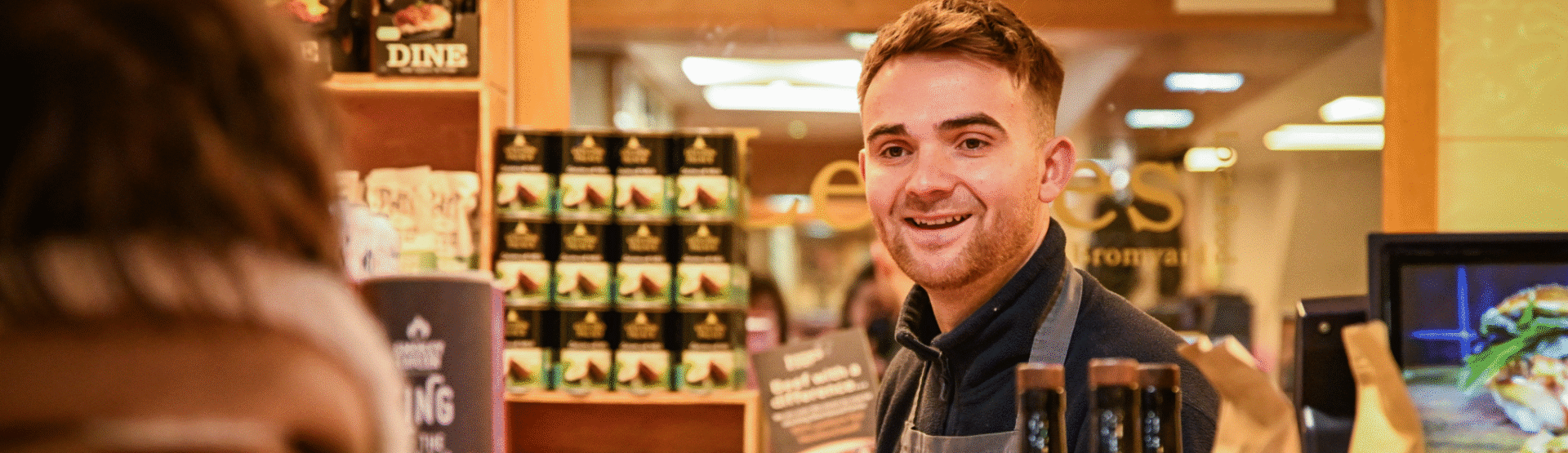 Smiling team member serving a customer