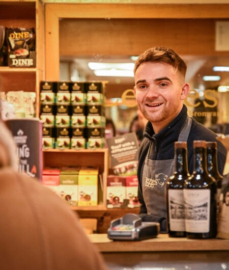 Smiling team member serving a customer