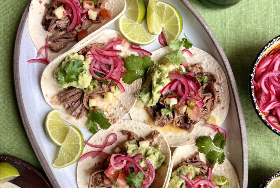 Hereford beef brisket tacos with charred pineapple salsa and pink pickled onions