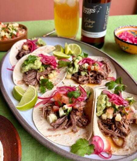 Brisket tacos with charred pineapple salsa and pink pickled onions recipe.