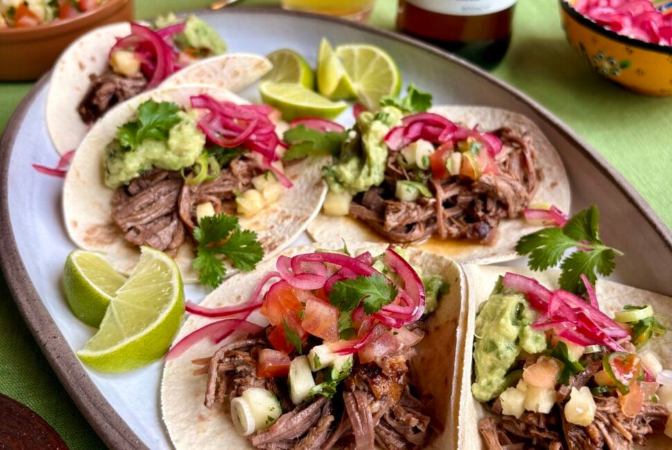 Hereford beef brisket tacos with charred pineapple salsa and pink pickled onions
